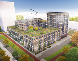 Luchtfoto van een wooncomplex met groene daken en een centrale binnentuin, met vogels in de lucht.